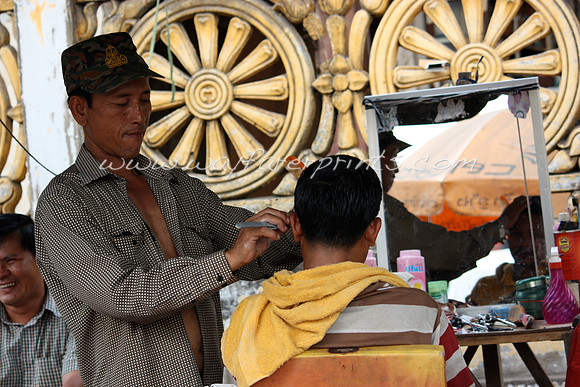 16. Street Barber - Phnom Penh, Cambodia